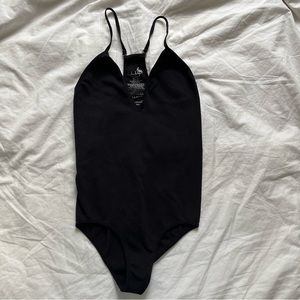 Free People black seamless ribbed racer back bodysuit